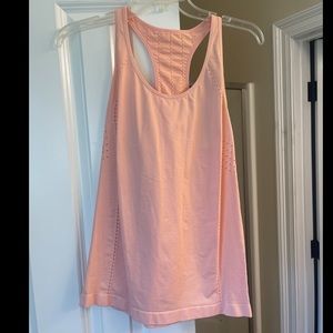 Cute blush pink workout tank. More form fitting & hardly worn.